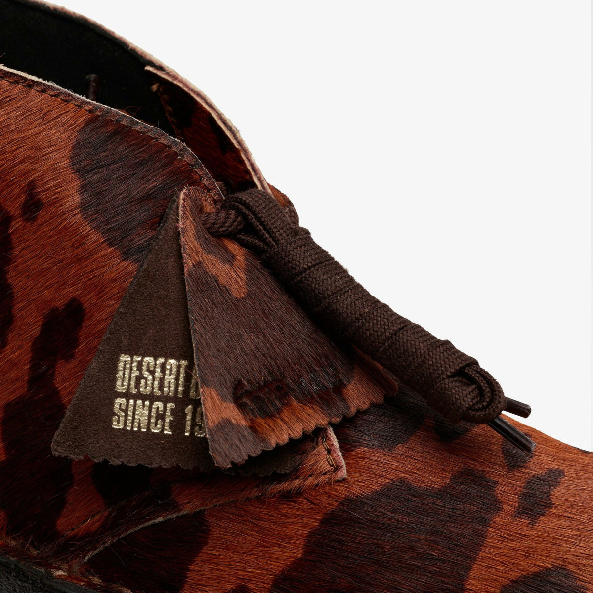 Clarks Women Desert Boot. Brown Cow Print